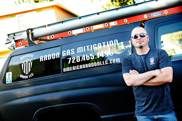 John Cardos with service truck for radon Mitigation and testing in the Denver Metro Area